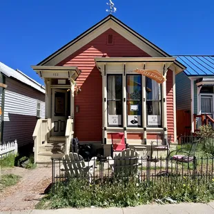 a red house with a blue roof