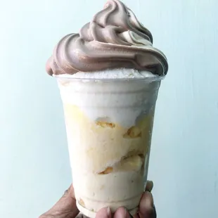 Pineapple ice cream on the bottom and Italian ice (pineapple, melon, and passion fruit) top with vanilla and chocolate soft serve. Awesome!