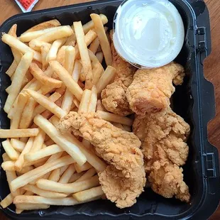 a tray of fried chicken and french fries