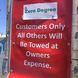 a red sign with white lettering