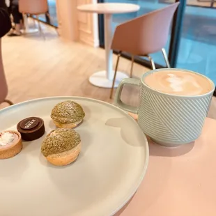 a plate of pastries and a cup of coffee