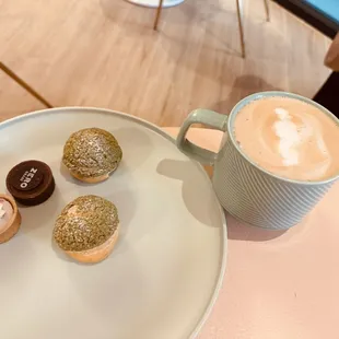 a plate of pastries and a cup of coffee