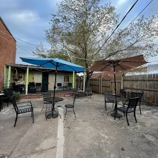 patio area with tables and umbrellas