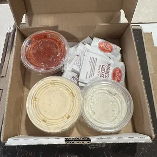 Ranch, Jalapeño Ranch, Cheesy Bread Dipping Sauce, and Parmesan Cheese packets