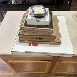 Pizza boxes and Chocolate Cake