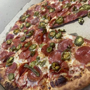 Amazing pepperoni and jalapeño pizza.