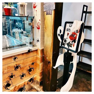 a sign with a spider on it