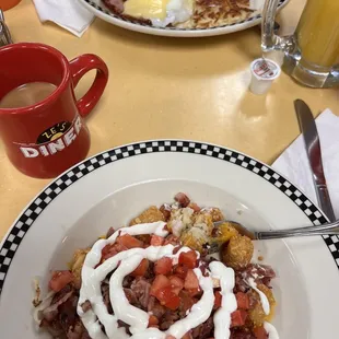 Tater tot nachos on my side of the table. Looks like a Benedict across from me. They refilled our coffee multiple times, it was great