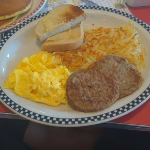 Grand Slam: 2 eggs, 2 meats, 2 pancakes, hash browns and toast!