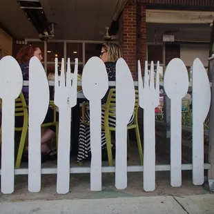 Cute fence around covered outdoor seating