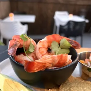 a bowl of shrimp and chips