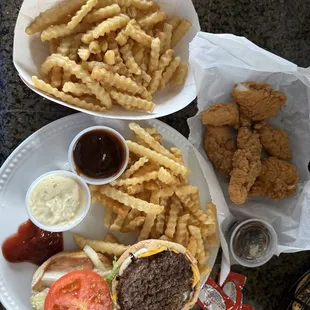 Cheeseburger, fries, double chicken strips and chips