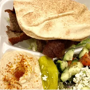 a meal in a styrofoam container