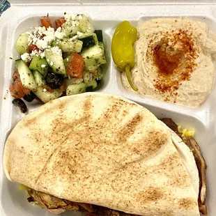 a meal in a styrofoam container