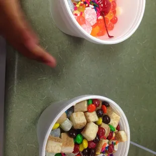 two bowls of fruit and candy