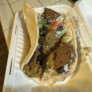 Falafel gyro very thick sauce.