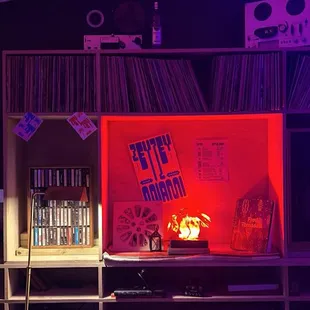 a living room with vinyl records on the wall