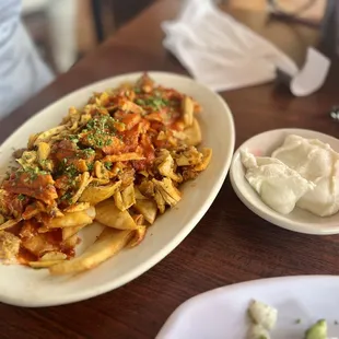 a plate of pasta and a side dish