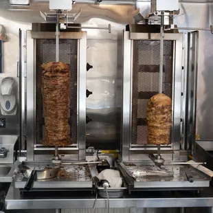 two kebabs being cooked