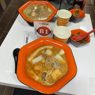 a bowl of soup with meat and vegetables