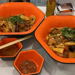 three bowls of food on a table
