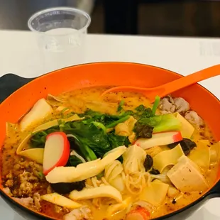 a bowl of noodles and vegetables