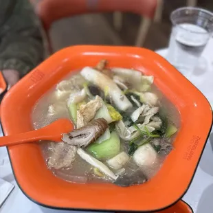 Mushroom broth with veggies, fish balls, meat, frog legs