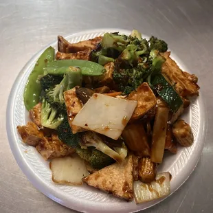 a plate of stir fried vegetables