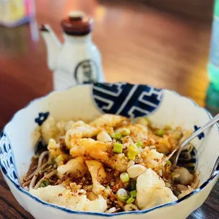 a bowl of chinese food