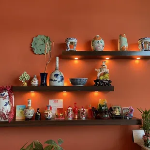 a shelf with vases on it
