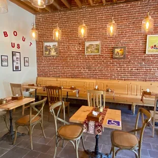 a dining area with tables and chairs