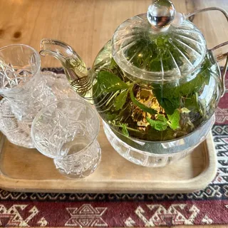 Hot tea kettle thyme and mint