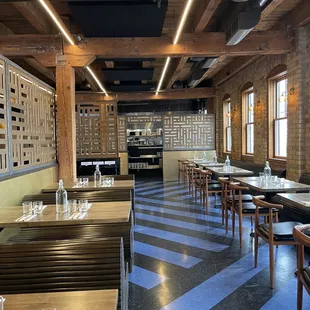 a dining area with tables and chairs
