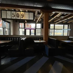 a restaurant with booths and tables
