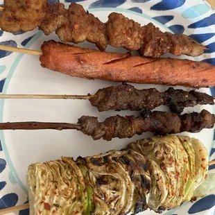 Top to bottom: pork belly, Chinese hot dog, lamb, special lamb, cabbage.