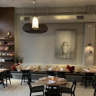 a dining area with tables and chairs