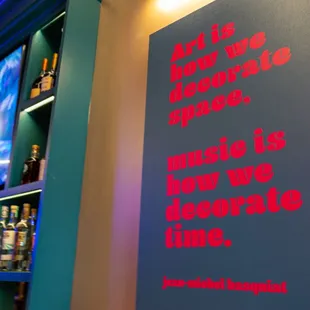 Poster of Jean-Michel Basquiat quote. "Art is how we decorate space, music is how we decorate time."