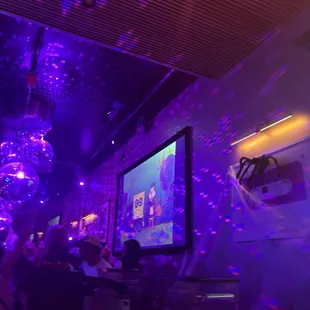 There were big projector style screens in the bar playing clips of SpongeBob. Later swapping to Halloween movies.