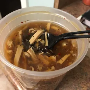 a bowl of soup with a spoon in it