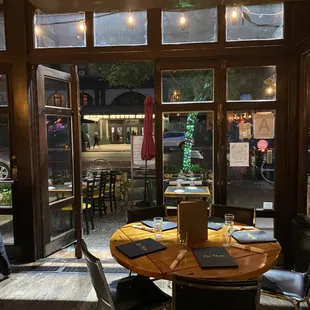 a dining room with a laptop on a table