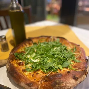 Formaggi brick oven pizza with added fresh arugula