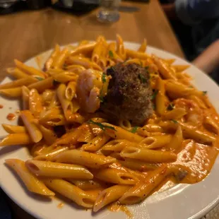 a plate of pasta and meatballs