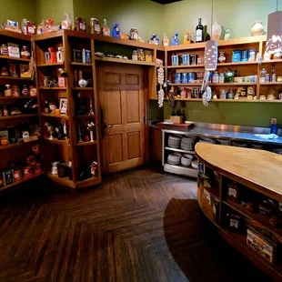 a kitchen with a counter and shelves