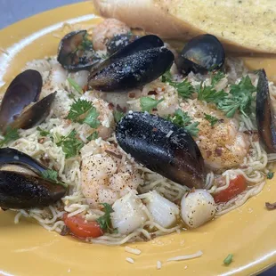 Seafood pasta shrimp mussels and scallops scampi
