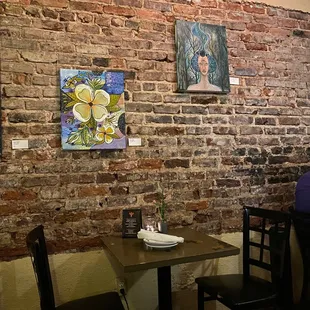 Great art dots the exposed brick walls