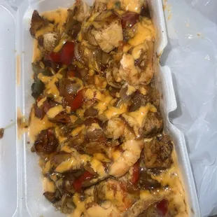 Shrimp and chicken rice bowl with extra sauce