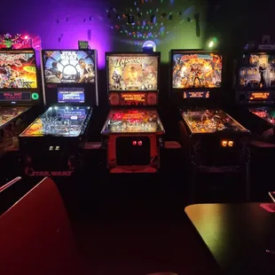 a row of pinball machines