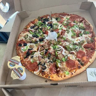 16" supreme, olives on half and added jalapeños