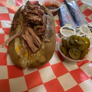 Wednesday special... Loaded mesquite smoked potato with brisket, cheese &amp; B.B.Q sauce