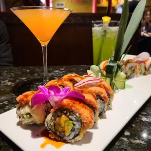a plate of sushi and a cocktail